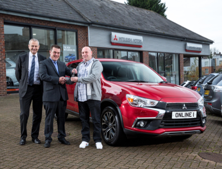 2-Antony-Deane-is-presented-with-his-new-Mitsubishi-ASX-by-Grosvenor-Garage-s-David-Fox,-Sales-Executive,--middle--and-David-Munns,-Dealer-Principal.jpg